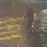 Birmingham mum Laura Marriott wades into floods to clear drains