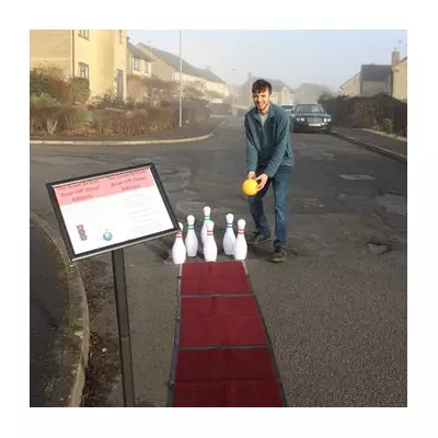 Man Turns Pothole into Bowling Alley in 'Great British Bowl-Off' Protest