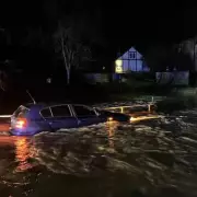 BMW driver rescued from roof after ignoring flood gauge in Leicestershire