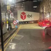 DPD Lorry Gridlocks Birmingham Street After Failed Tight Turn, Police Intervene