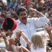 Maduro's Arrest: Venezuelan Leader Grins in Handcuffs During DEA Procession
