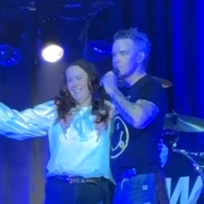 Robbie Williams Invites Viral Superfan On Stage at Wolverhampton Concert