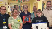 Former Burns Patient Seth, 10, Donates Gaming Consoles to Children's Ward