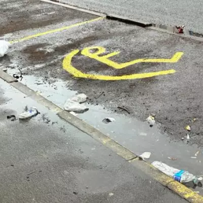 Fake Disabled Parking Sign Painted on Birmingham Street in Parking Dispute