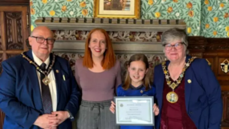 10-Year-Old Dribbles Football 10 Miles for Team Fundraiser