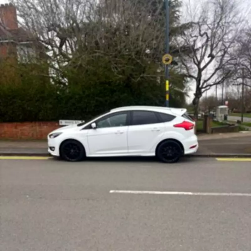 Council Workers Paint Double Yellow Lines Around Parked Car in Quinton