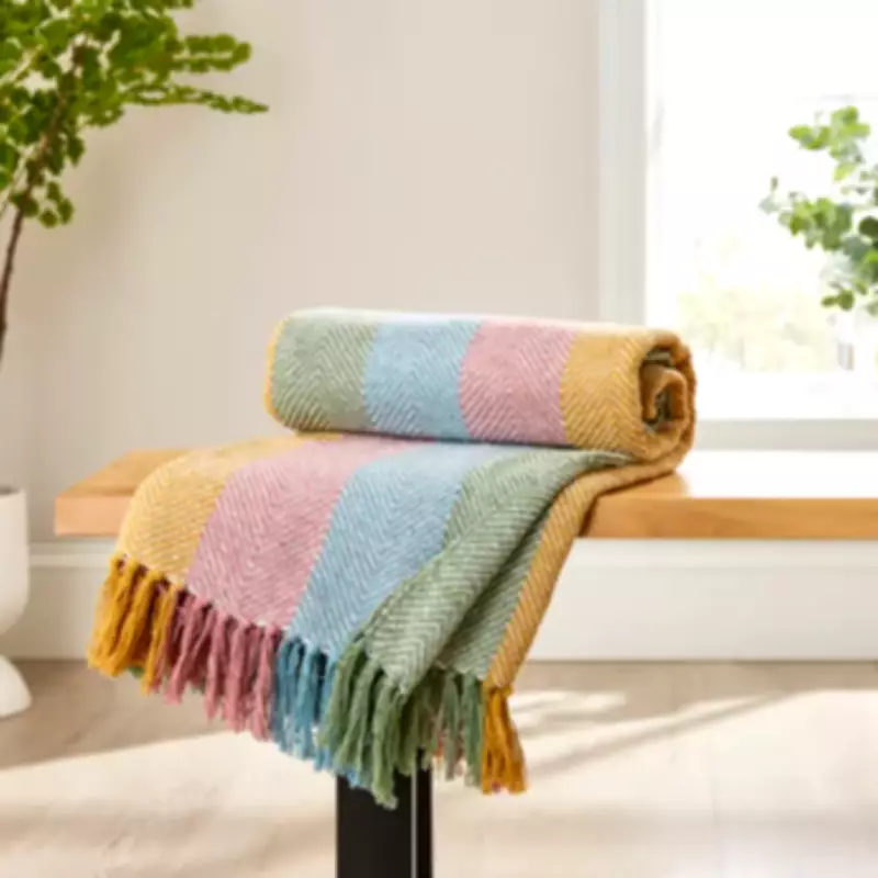 Dunelm's £28 Herringbone Throw in Spring Colors Adds Vibrant Pop to Home Decor