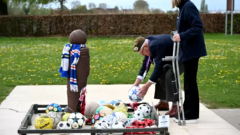 Fundraiser Lays Footballs at Christmas Truce Memorial in Belgium