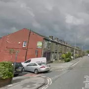 Man Detained After Two Linked Stabbings in Bolton Cafe Attack