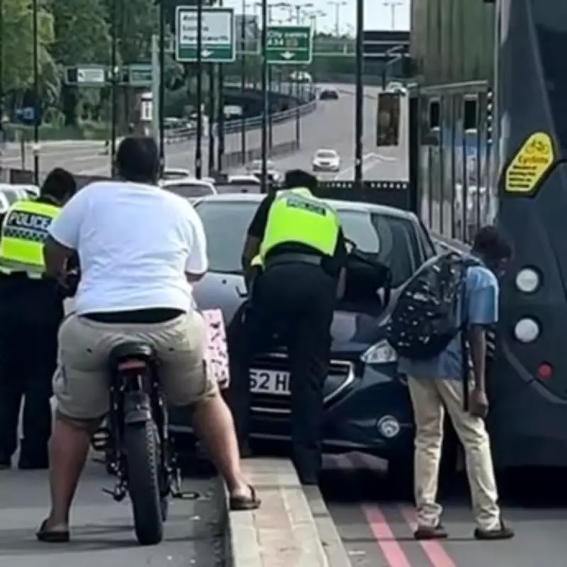 Car Trapped Wrong Way Beside Bus on Busy Birmingham Route Sparks Confusion