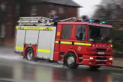 Dozens of Firefighters Battle House Fire in Birmingham, Road Closed
