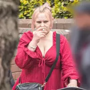 Pregnant Woman in Dressing Gown Pulls Machete on Neighbor in Noise Row