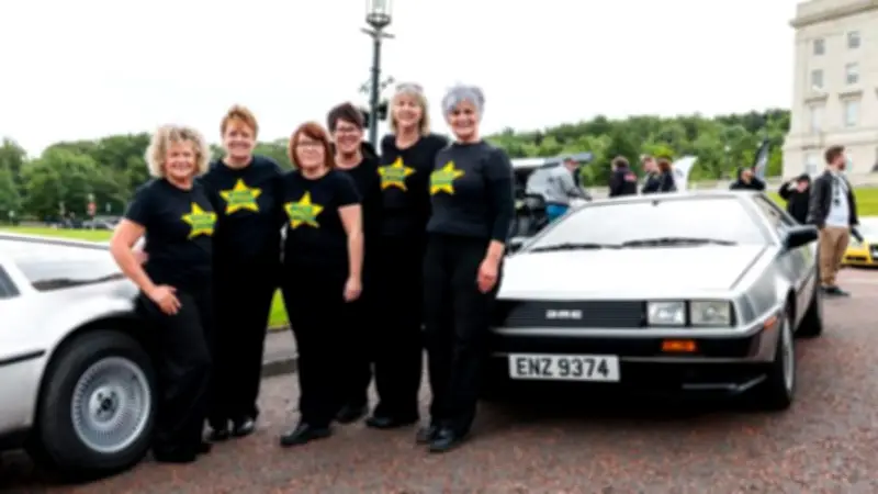 Over 275 Rock Choir Members Perform 'The Power of Love' at Stormont DeLorean Gathering