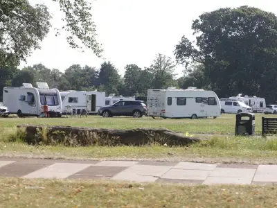 Travellers Set Up Camp at Birmingham Park Near Children's Play Area