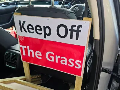 Volunteer group fights grass verge parking in Hall Green with signs