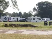 Travellers Set Up Camp at Birmingham Park Near Children's Play Area