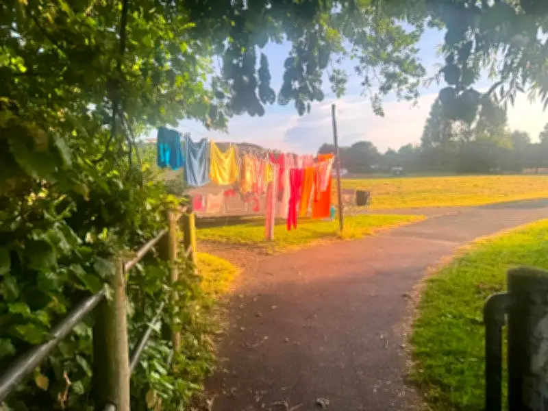 Travellers set up camp with horses and washing at Witton Lakes beauty spot