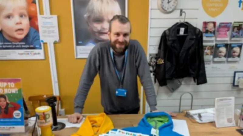 Volunteer Tom Kirkham Secures Paid Work After Decade of Service at Bangor Charity Shop